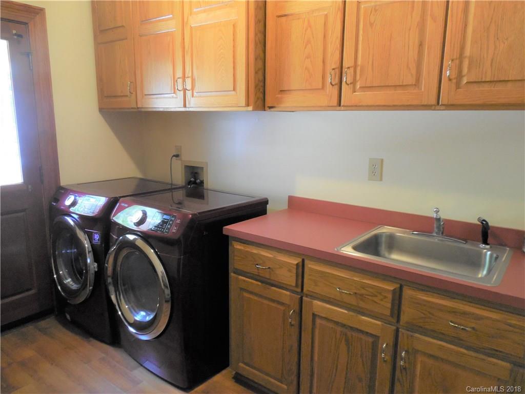 930 Shive Road Salisbury, NC 28146 - Photo 17 of 36 a utility room with sink dryer and washer