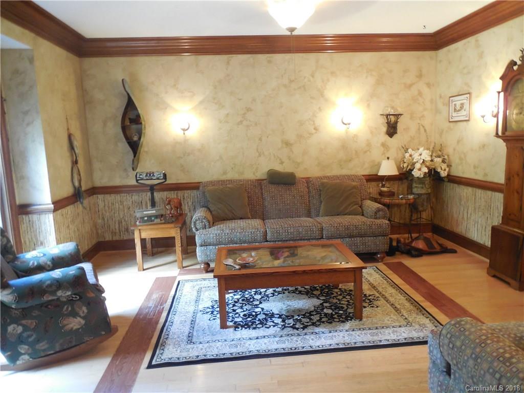 930 Shive Road Salisbury, NC 28146 - Photo 19 of 36 a living room with furniture and a rug