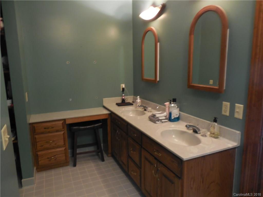 930 Shive Road Salisbury, NC 28146 - Photo 23 of 36 a bathroom with a sink and a mirror