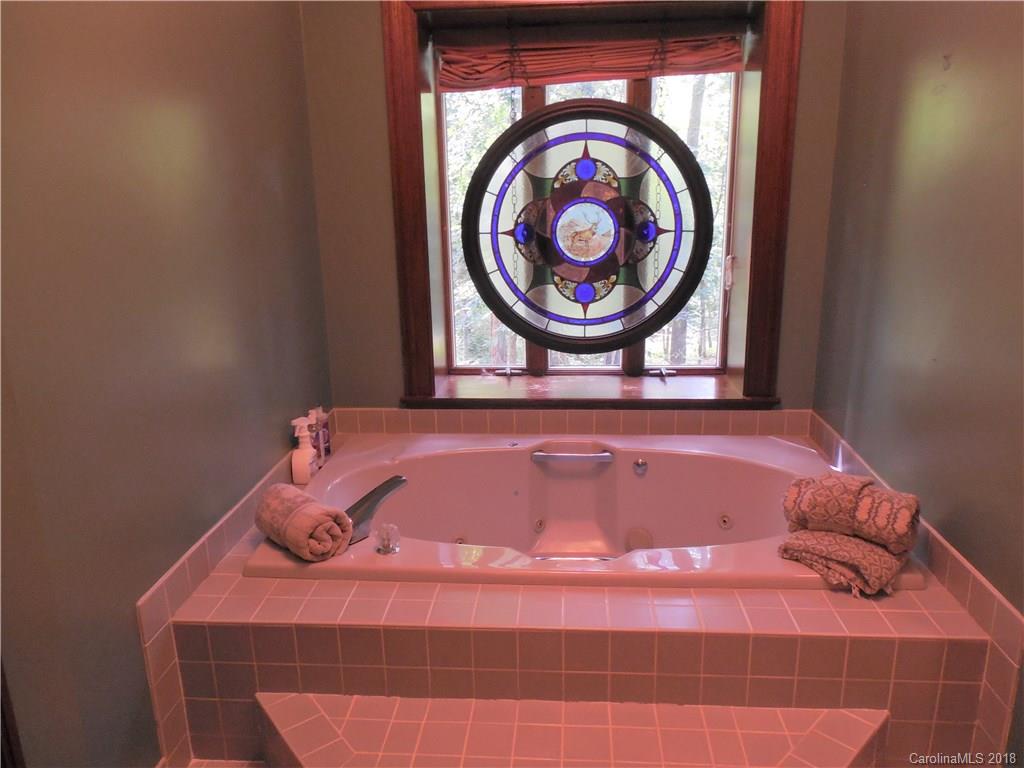 930 Shive Road Salisbury, NC 28146 - Photo 24 of 36 a bathroom with a sink and a mirror