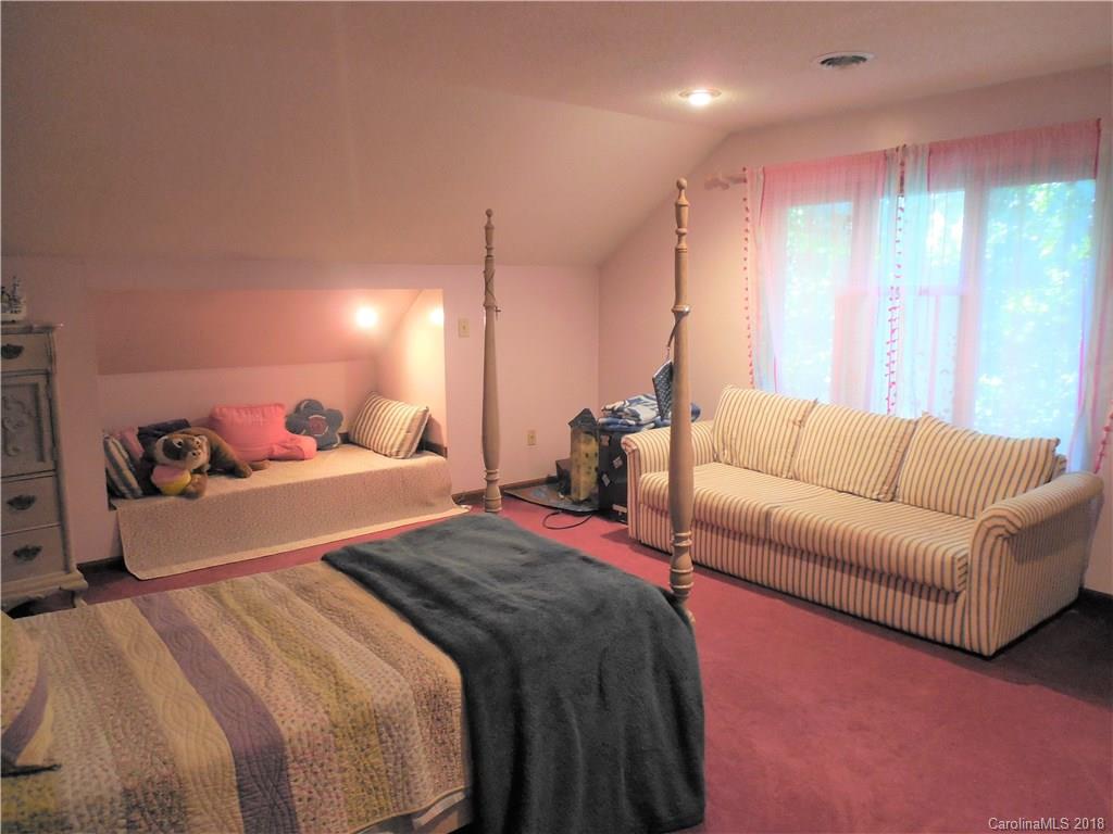 930 Shive Road Salisbury, NC 28146 - Photo 25 of 36 a bed room with a bed and a couch