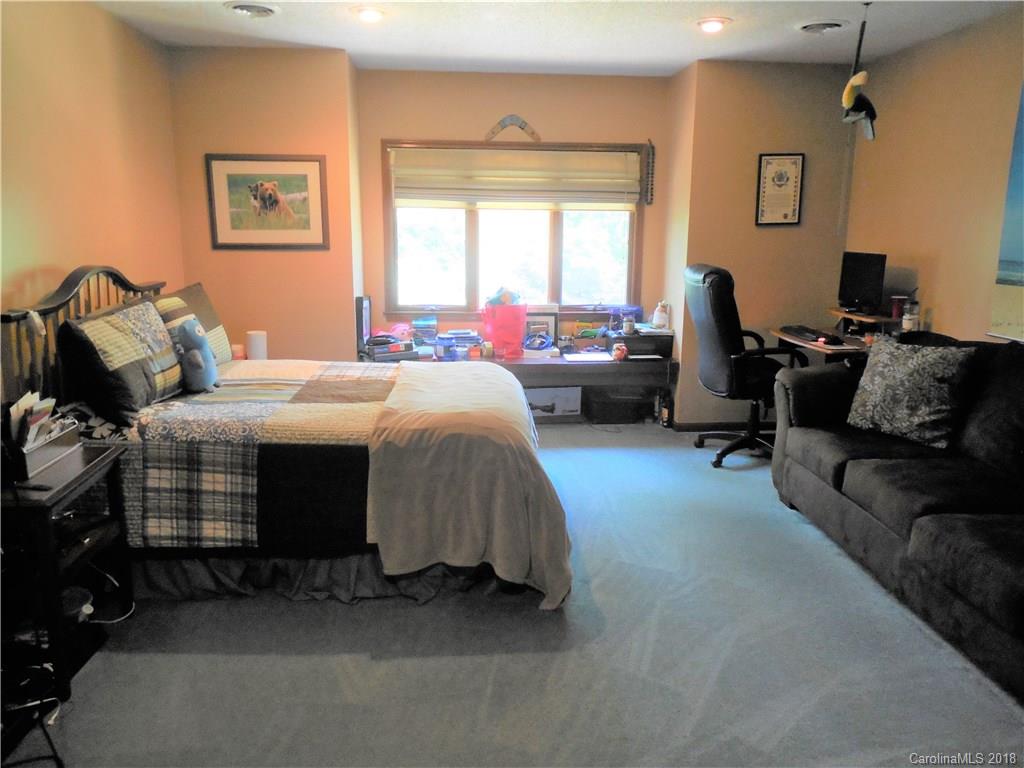 930 Shive Road Salisbury, NC 28146 - Photo 27 of 36 a bedroom with bed couch and window