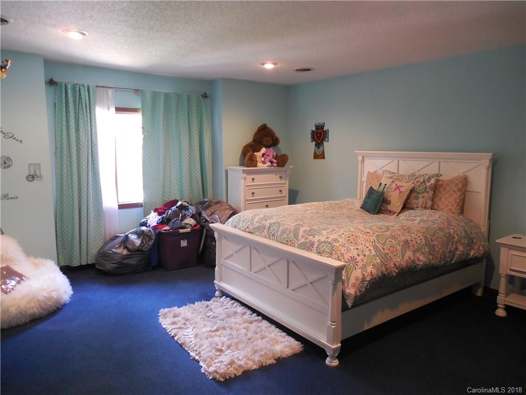 930 Shive Road Salisbury, NC 28146 - Photo 29 of 36 a bedroom with a bed couch and window