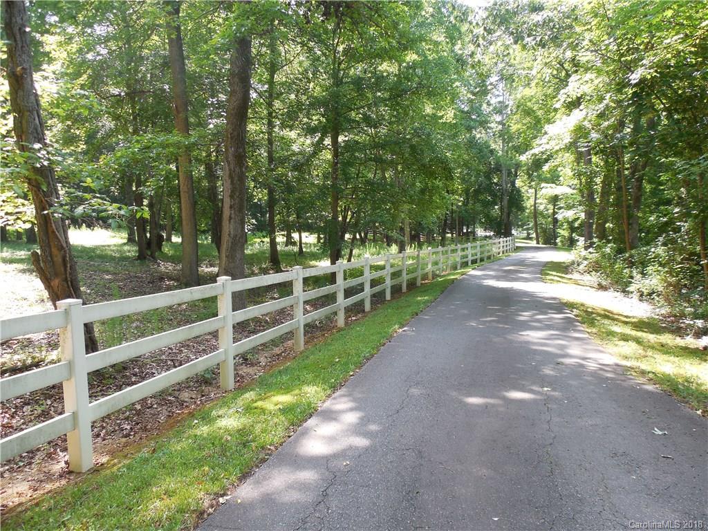 930 Shive Road Salisbury, NC 28146 - Photo 4 of 36 a view of a yard with wooden fence