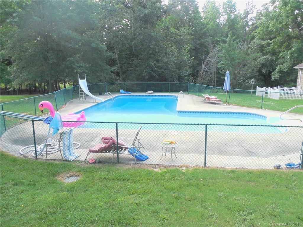 930 Shive Road Salisbury, NC 28146 - Photo 32 of 36 a backyard of a house with table and chairs
