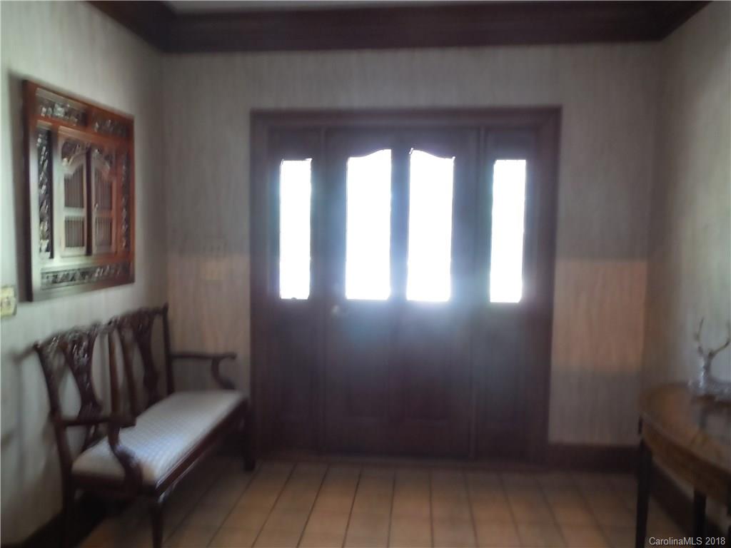 930 Shive Road Salisbury, NC 28146 - Photo 8 of 36 a view of a hallway with wooden floor and glass door