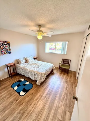 a living room with a bed furniture and a window