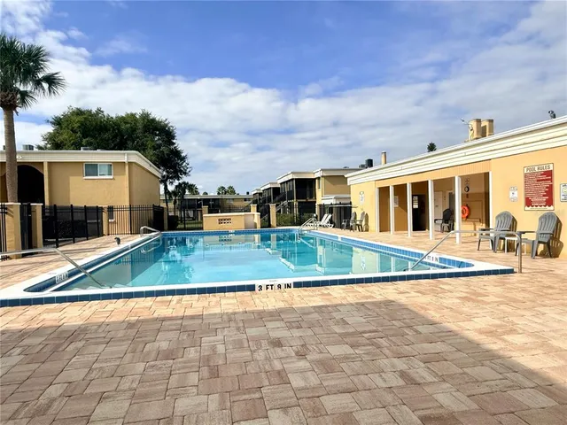 front view of a house with a swimming pool