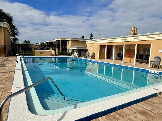a view of a balcony with two chairs