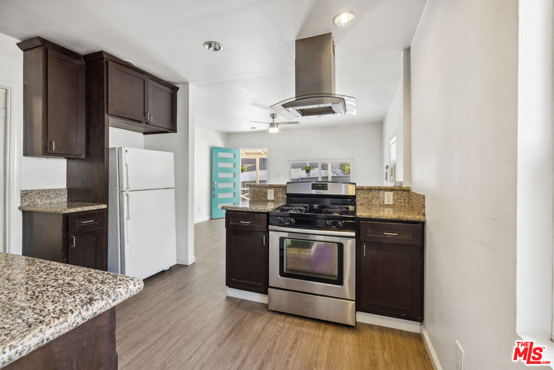 3110 Pyrites Street Los Angeles, CA 90032 - Photo 14 of 30 a kitchen with stainless steel appliances granite countertop a refrigerator stove a sink and a oven