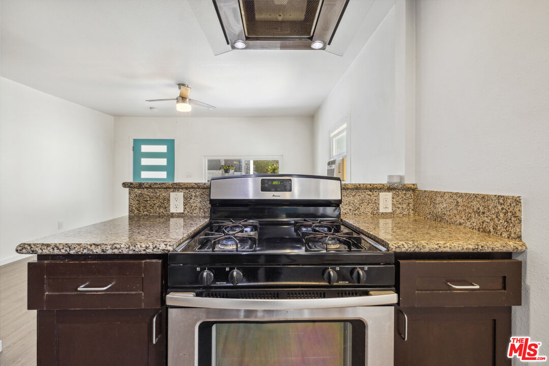 3110 Pyrites Street Los Angeles, CA 90032 - Photo 16 of 30 a kitchen with granite countertop stainless steel appliances a stove and a microwave