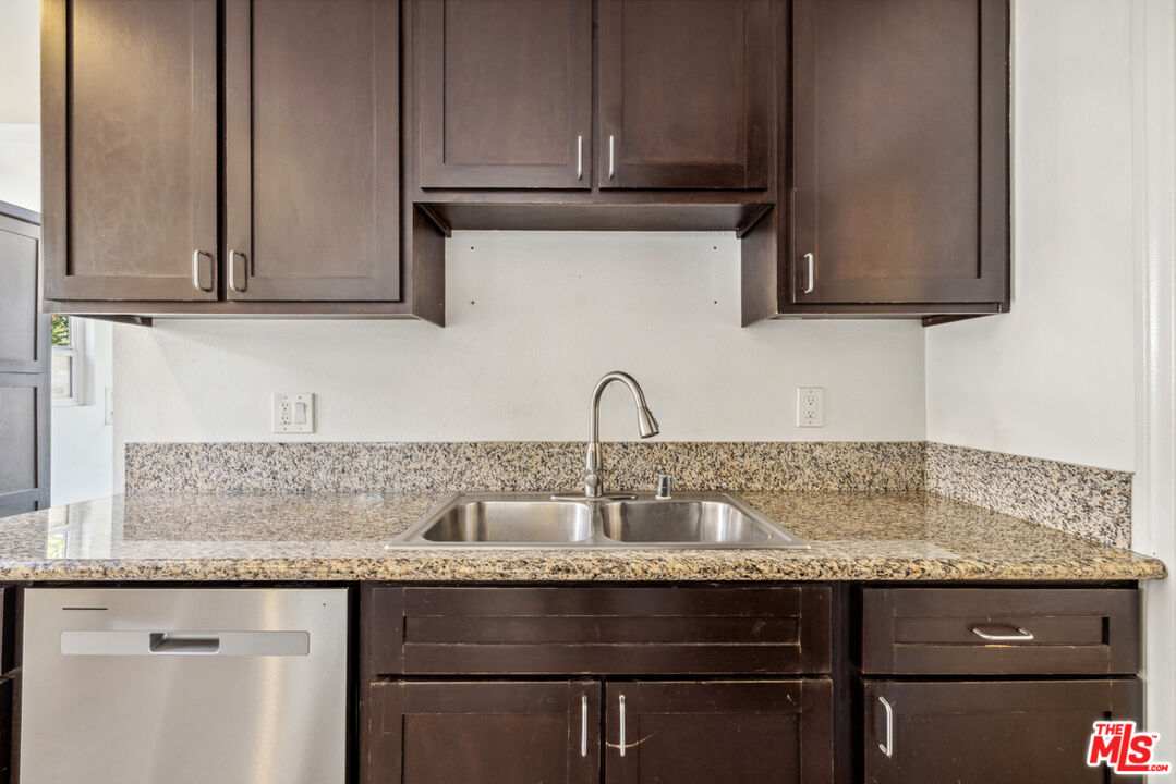 3110 Pyrites Street Los Angeles, CA 90032 - Photo 17 of 30 a sink with granite countertop cabinets and window