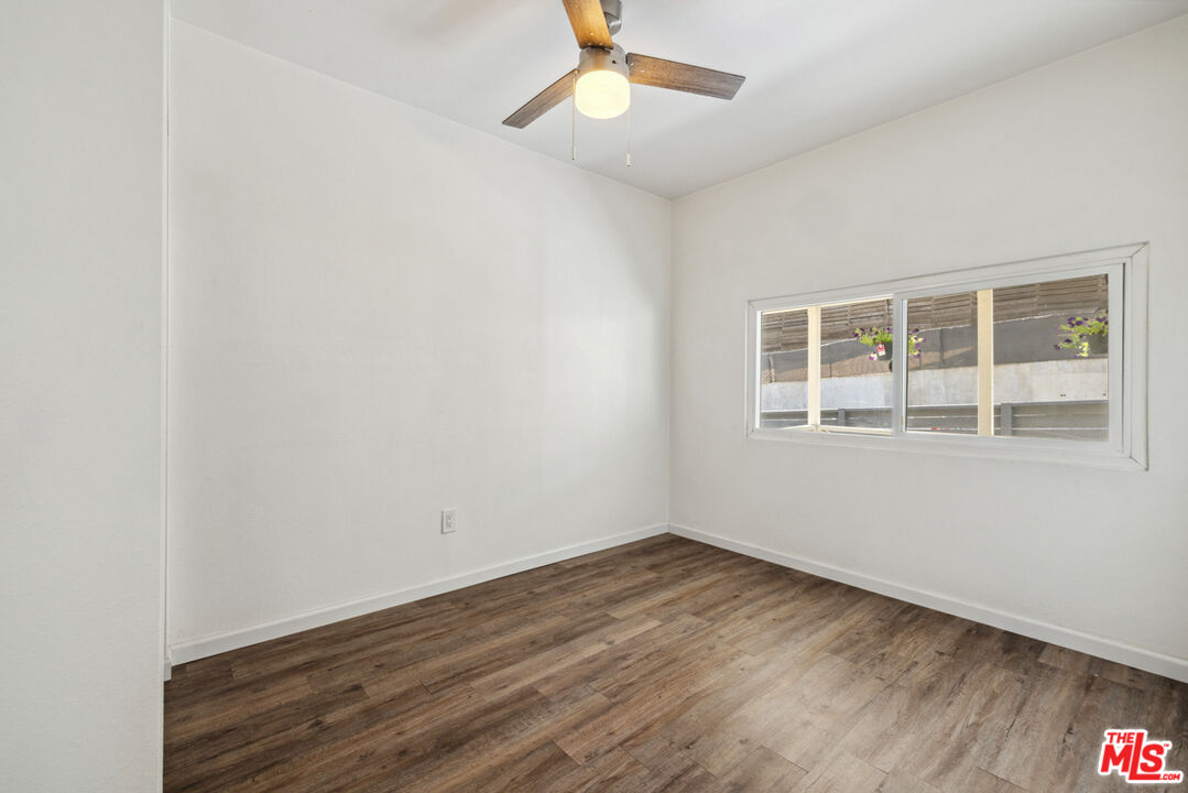 3110 Pyrites Street Los Angeles, CA 90032 - Photo 21 of 30 a view of empty room with wooden floor and fan