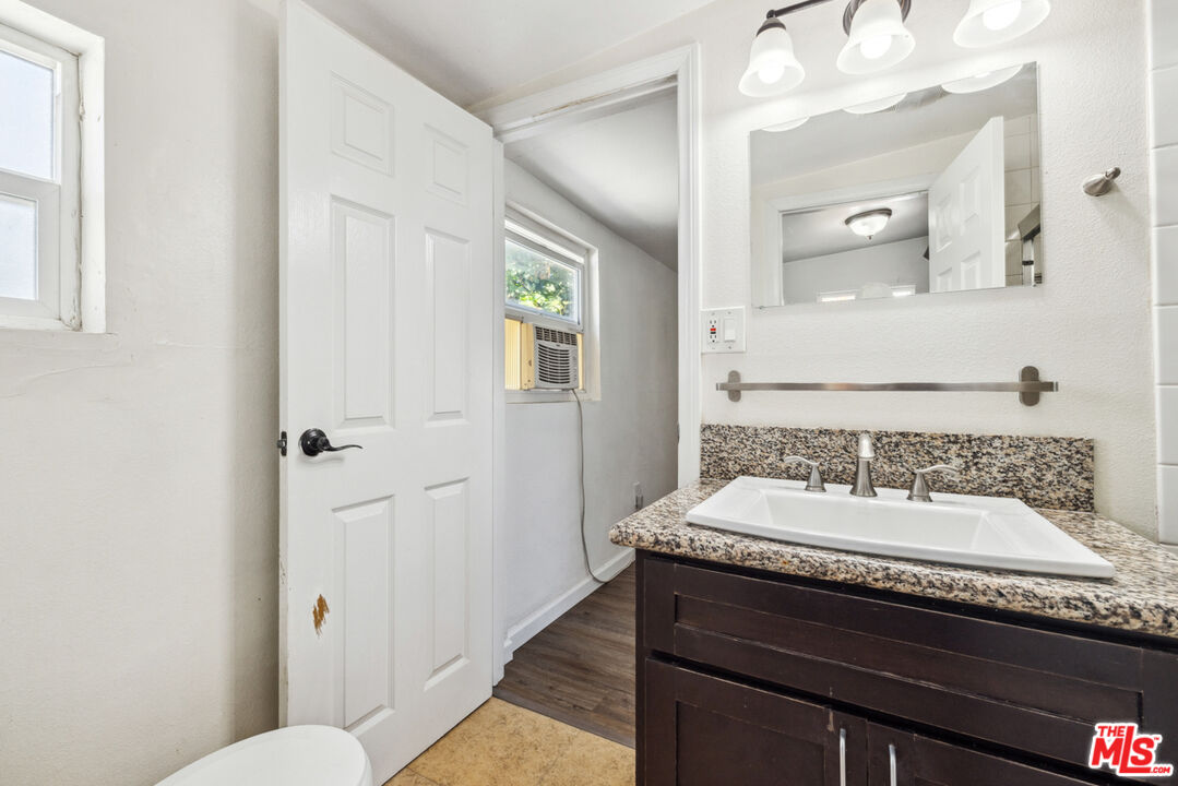 3110 Pyrites Street Los Angeles, CA 90032 - Photo 23 of 30 a bathroom with a sink and a mirror