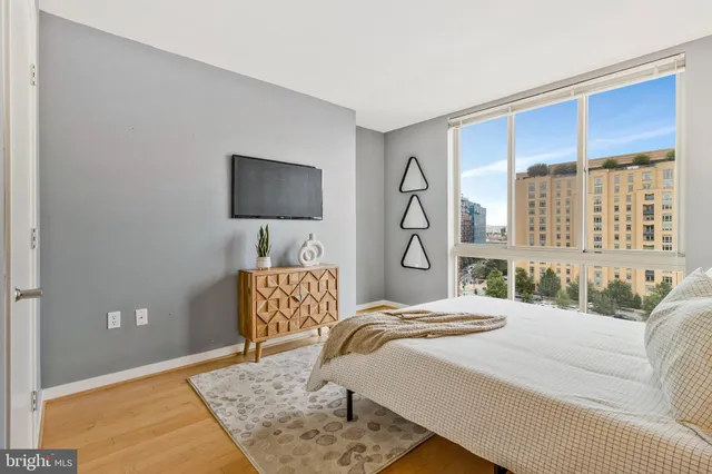 a bedroom with furniture and a window