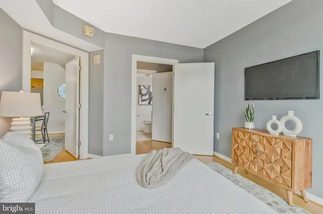 a bathroom with a toilet sink and shower