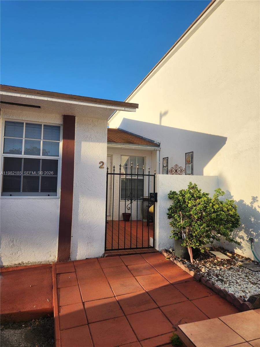 a view of front door and yard