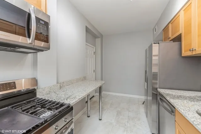 a kitchen with a stove and a microwave