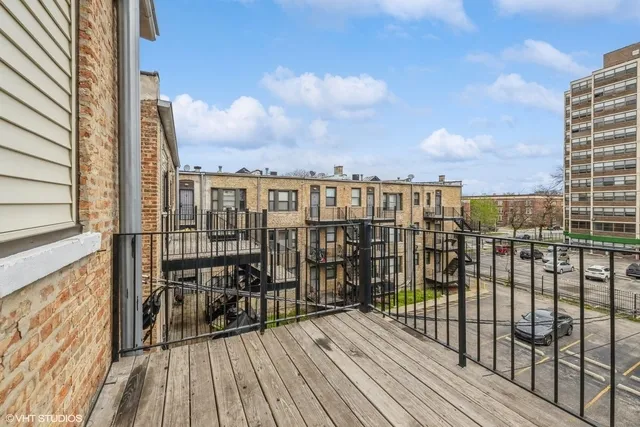 a view of a balcony with wooden floor