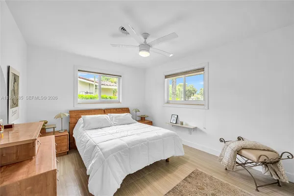 a bedroom with a bed and a couch