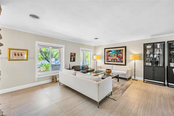 a living room with furniture and a window