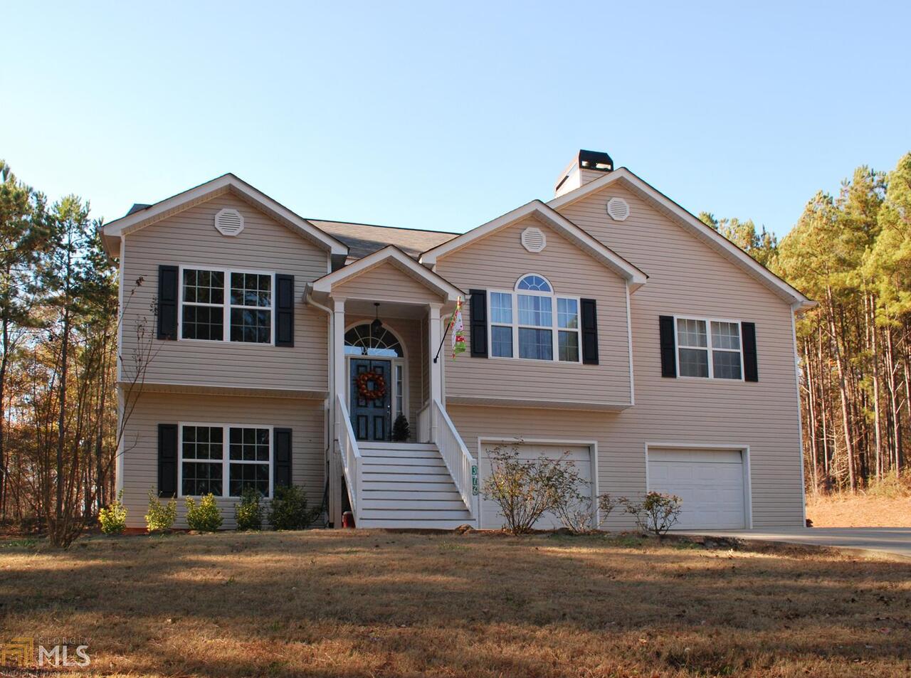 376 Sunset Ridge Drive Newnan, GA 30263 - Photo 1 of 1 a front view of a house with a yard