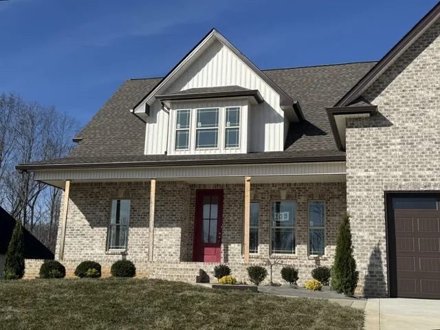 a view of empty room with window and ceiling fan