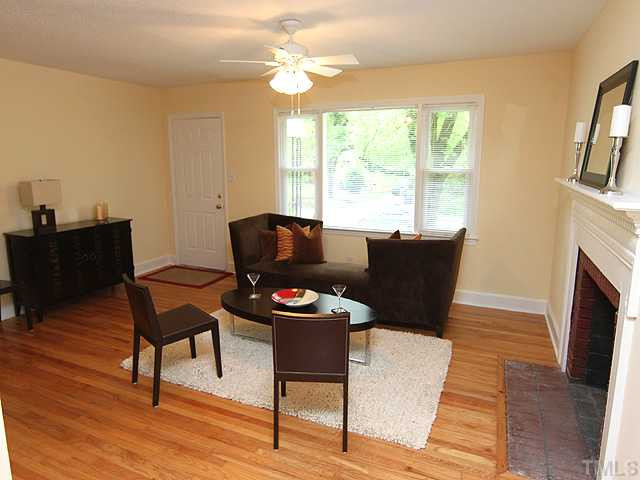 2109 Nelson Street Raleigh, NC 27610 - Photo 3 of 20 Another view of this spacious Living Room (14x18) with its beautifully refinished hardwoods, new ceiling fan/light and new vinyl windows. Living Room