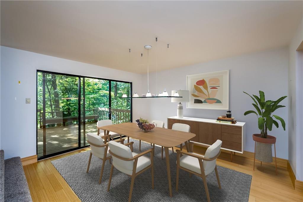 124 Berwyn Road Pittsburgh, PA 15237 - Photo 3 of 25 a dining room with furniture potted plants and wooden floor