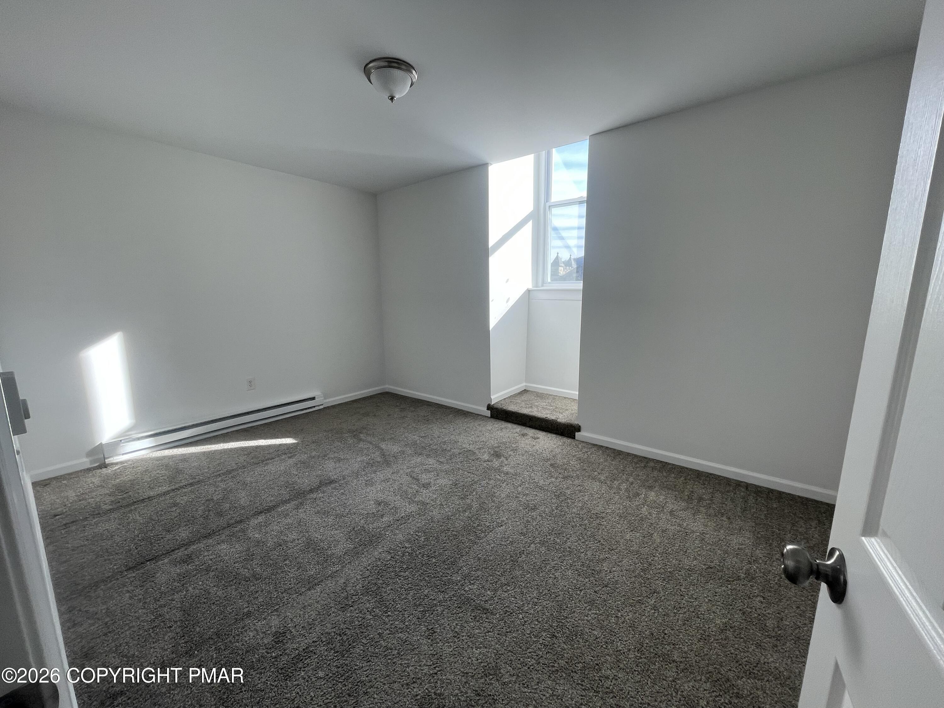 548 Main Street, Unit 6B Stroudsburg, PA 18360 - Photo 11 of 16 an empty room with windows
