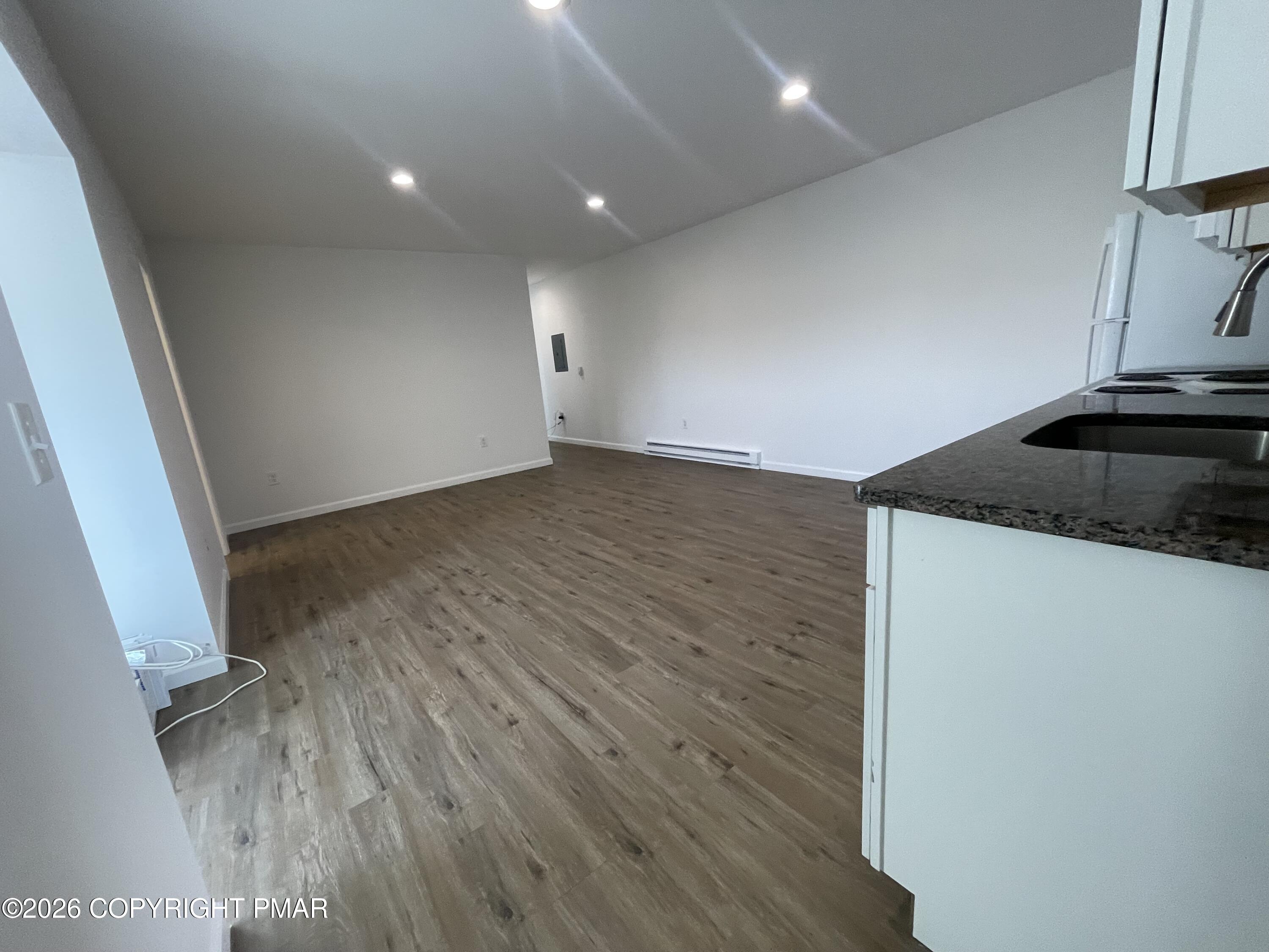 548 Main Street, Unit 6B Stroudsburg, PA 18360 - Photo 14 of 16 wooden floor in an empty room with a window