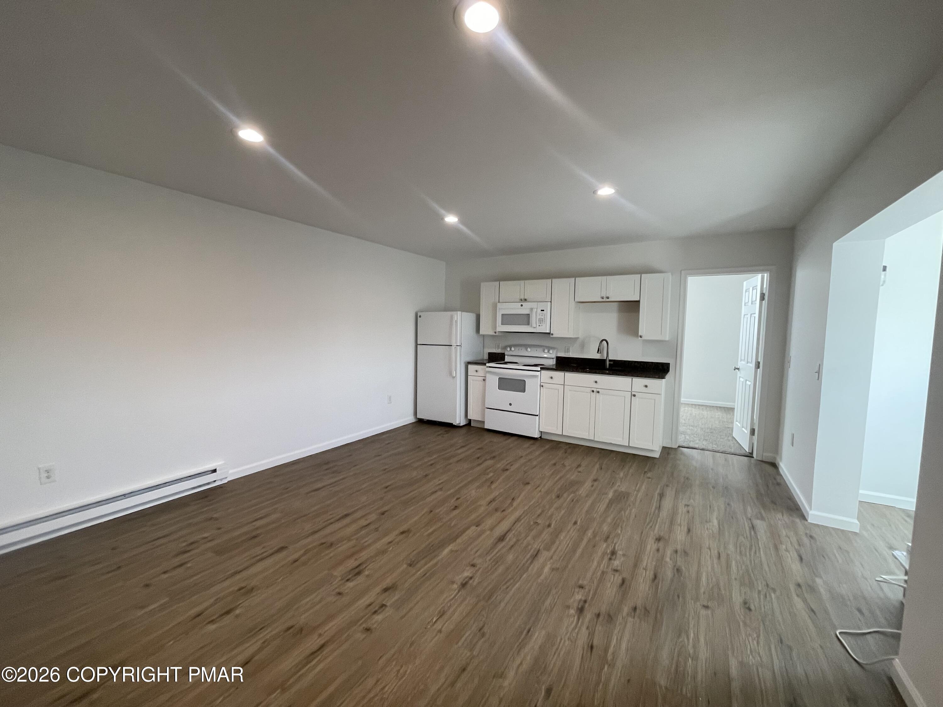 548 Main Street, Unit 6B Stroudsburg, PA 18360 - Photo 5 of 16 a view of kitchen with wooden floor