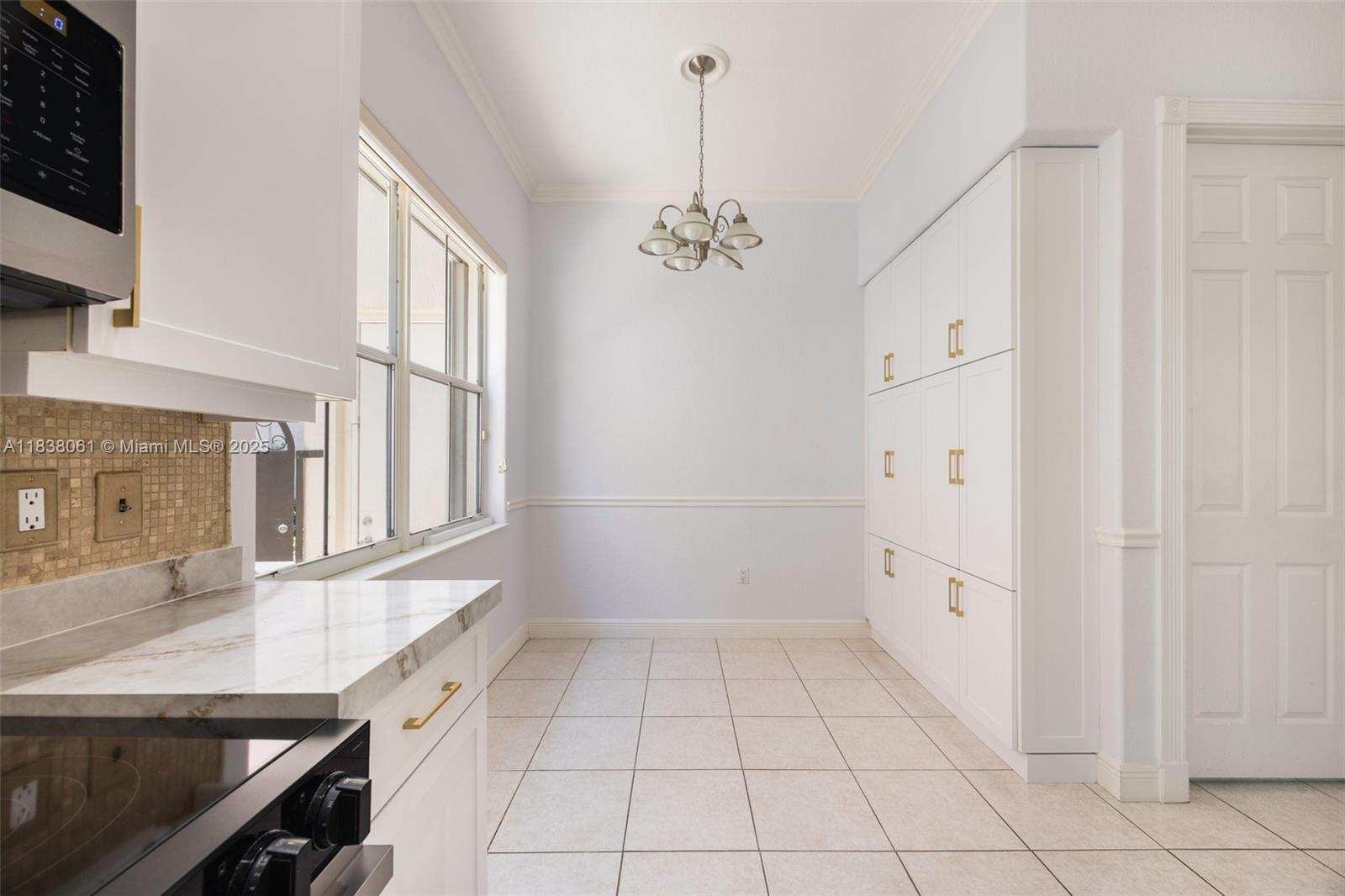 1571 Breakwater Terrace Hollywood, FL 33019 - Photo 12 of 42 a view of a kitchen with a sink and cabinets