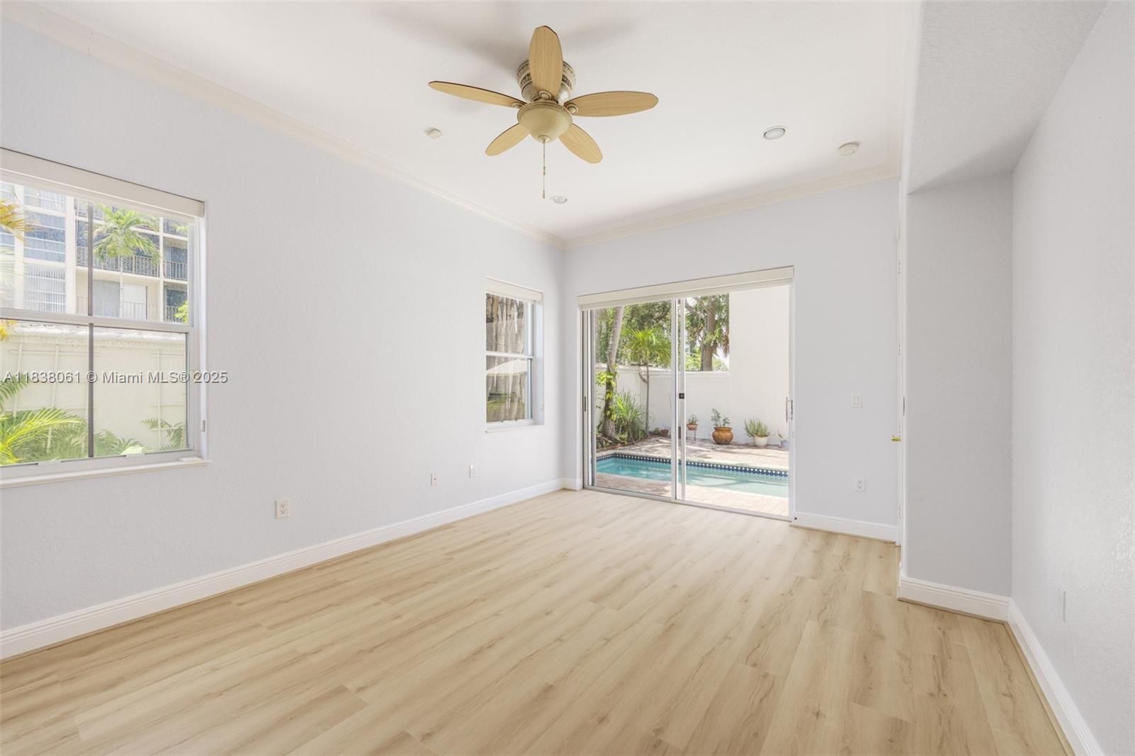1571 Breakwater Terrace Hollywood, FL 33019 - Photo 14 of 42 a view of empty room with wooden floor and fan