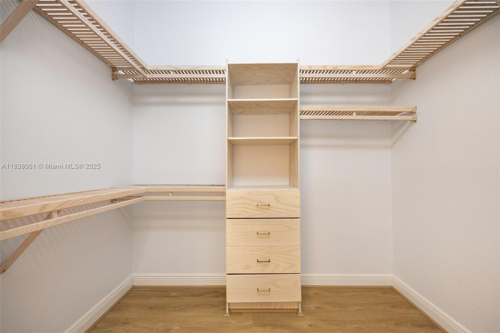 1571 Breakwater Terrace Hollywood, FL 33019 - Photo 17 of 42 a view of walk in closet with empty racks