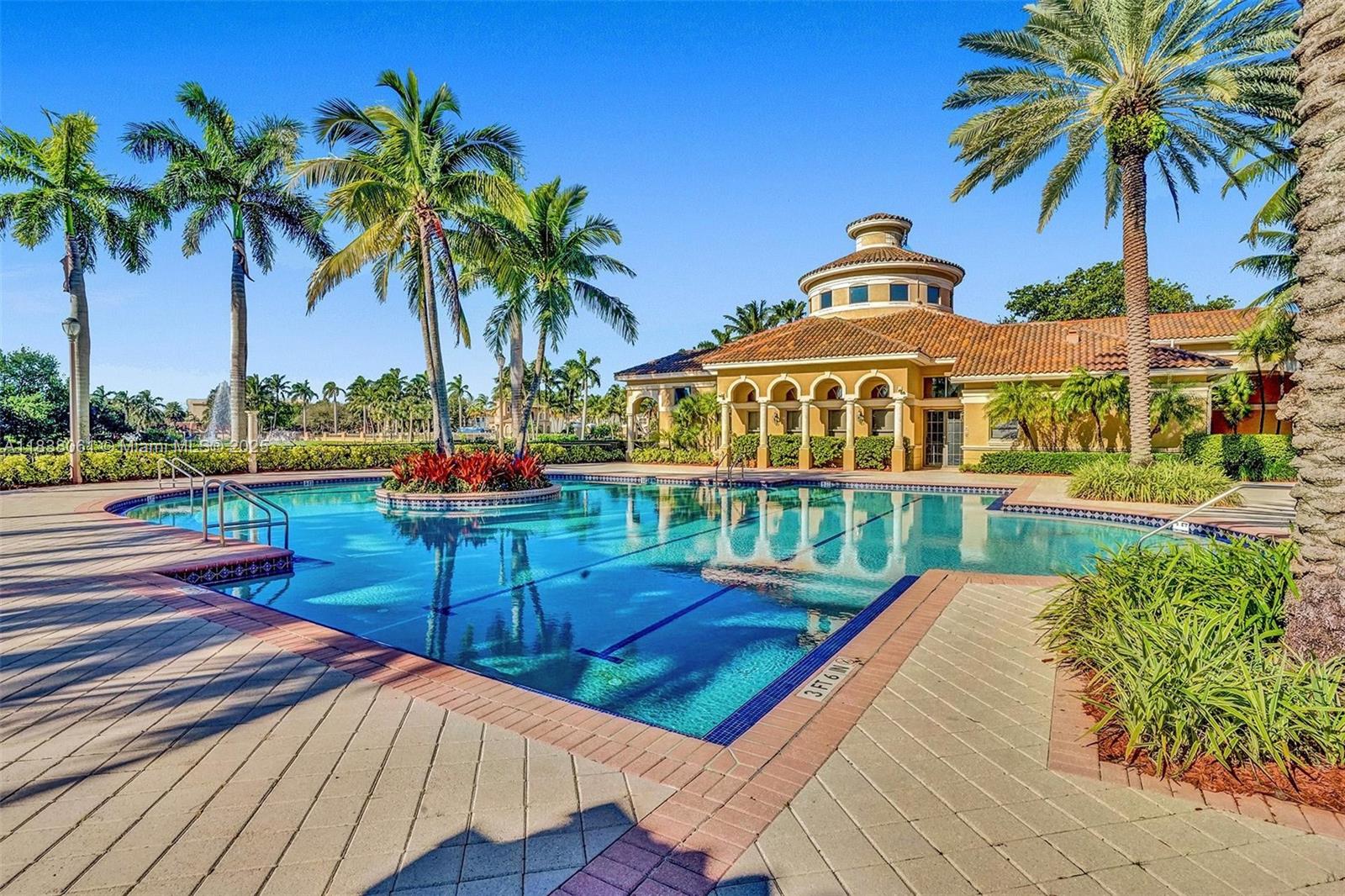 1571 Breakwater Terrace Hollywood, FL 33019 - Photo 27 of 42 a view of a swimming pool with a garden and patio