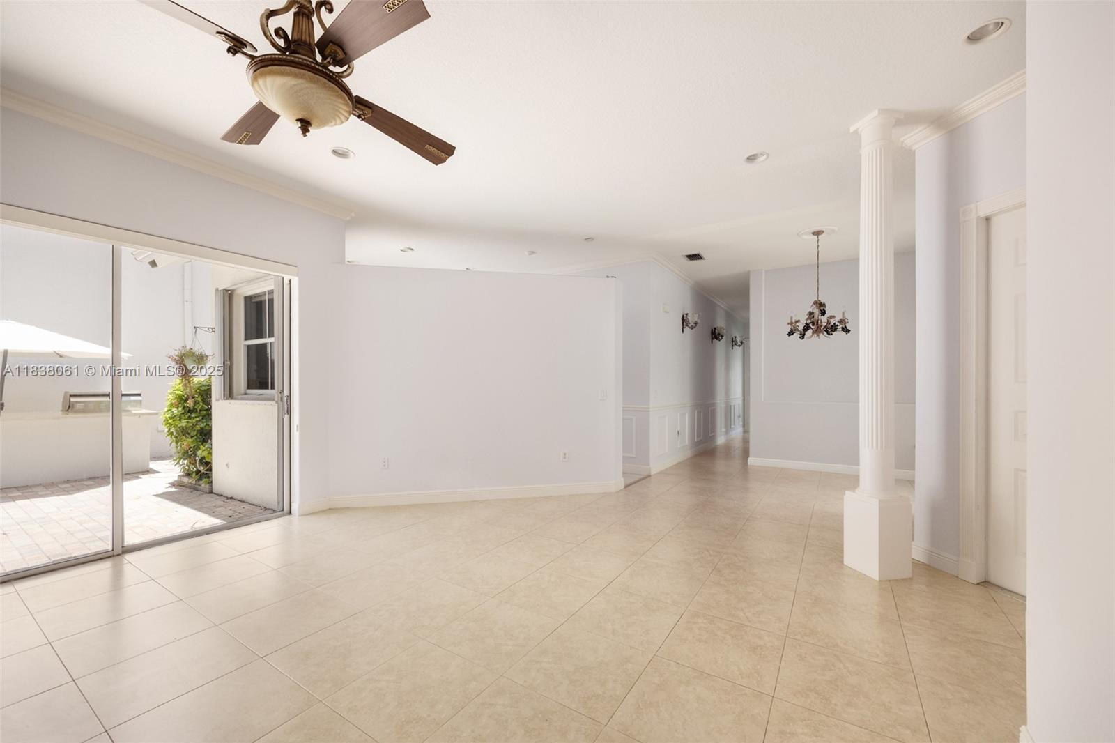 1571 Breakwater Terrace Hollywood, FL 33019 - Photo 7 of 42 a view of a livingroom with a ceiling fan & entryway