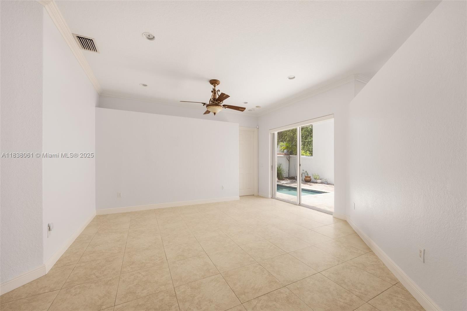 1571 Breakwater Terrace Hollywood, FL 33019 - Photo 9 of 42 a view of a livingroom with a ceiling fan and window