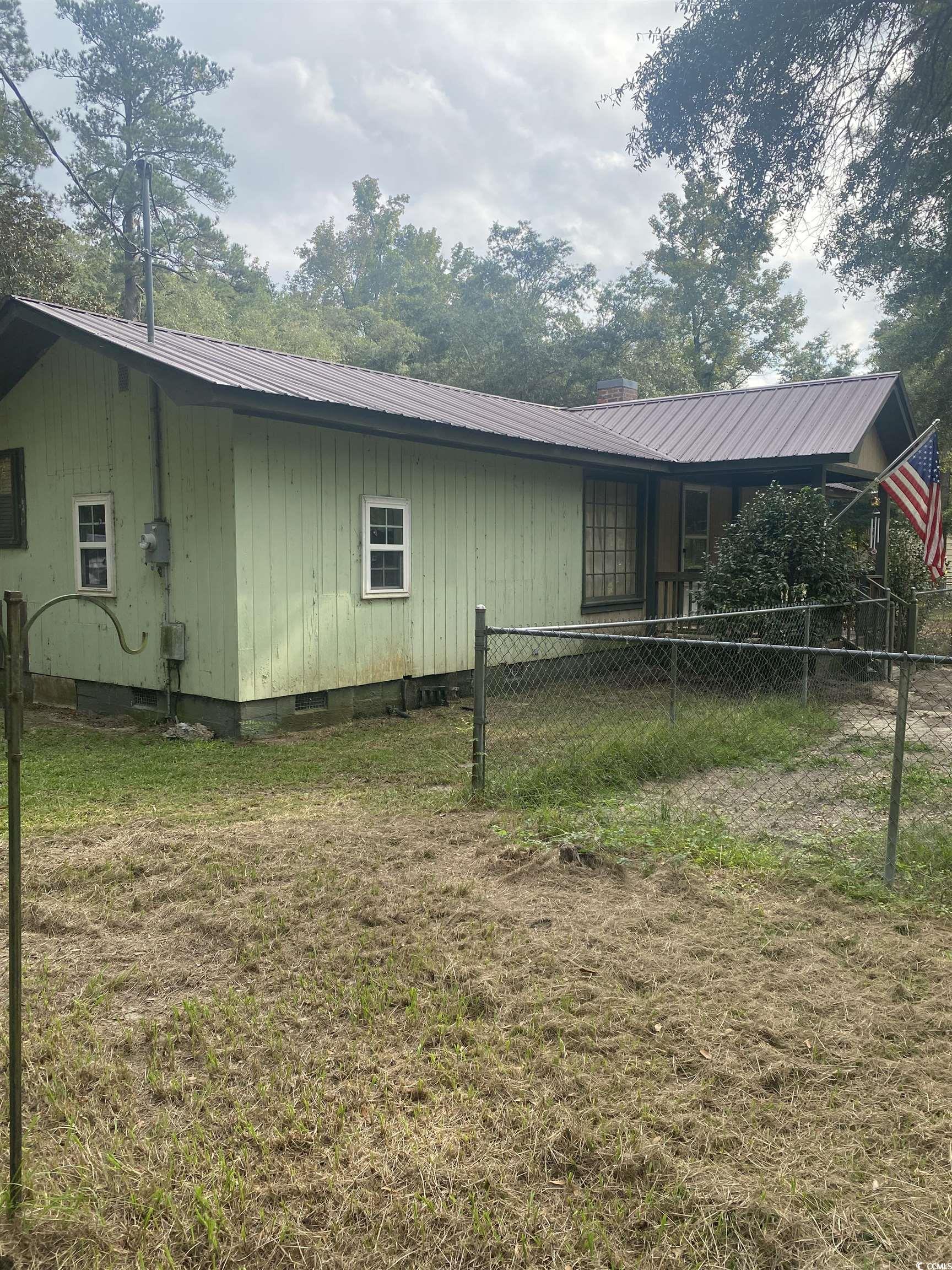 View of home's exterior featuring a yard
