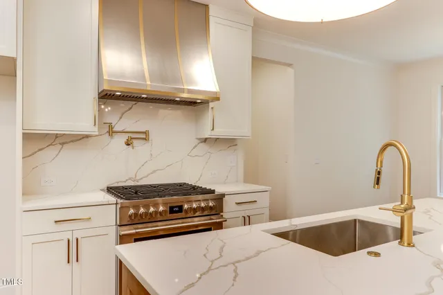 a kitchen with a stove and a sink