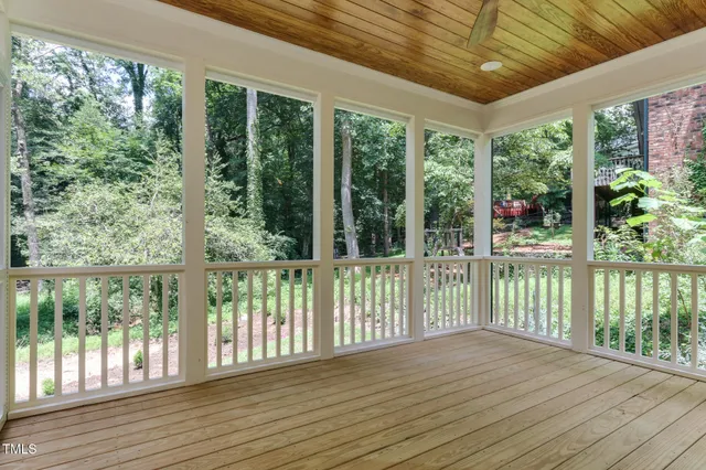 a view of balcony with wooden floor