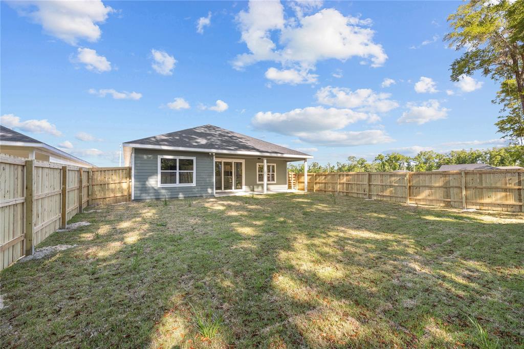 1086 Southwest 67th Drive Gainesville, FL 32607 - Photo 34 of 37 a view of a house with a yard