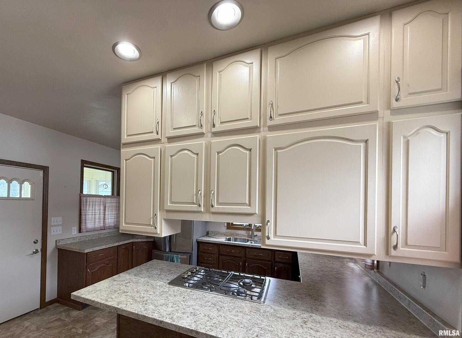 330 North Main Street Walcott, IA 52773 - Photo 17 of 39 a spacious bathroom with a granite countertop tub and a sink