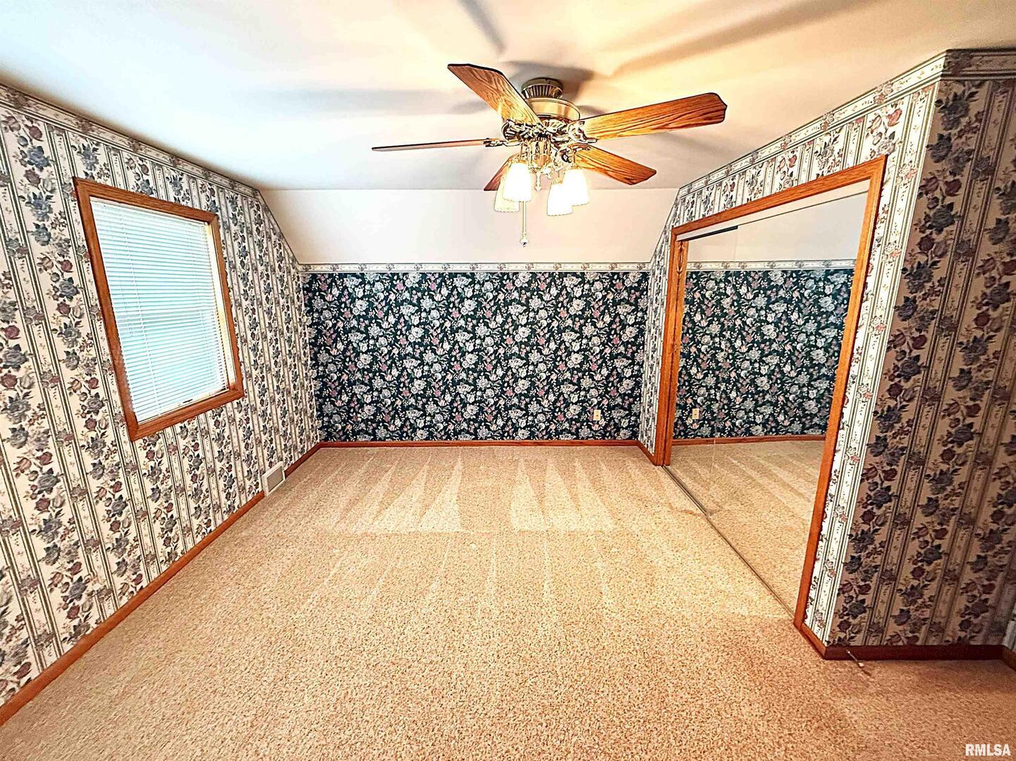 330 North Main Street Walcott, IA 52773 - Photo 22 of 39 a view of a hallway with wooden floor