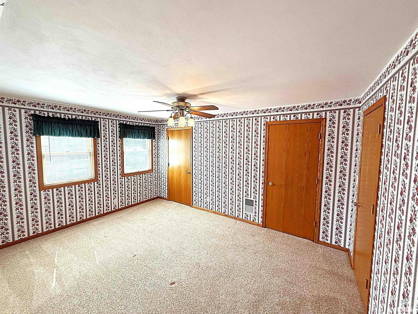 330 North Main Street Walcott, IA 52773 - Photo 24 of 39 a view of a livingroom with a staircase
