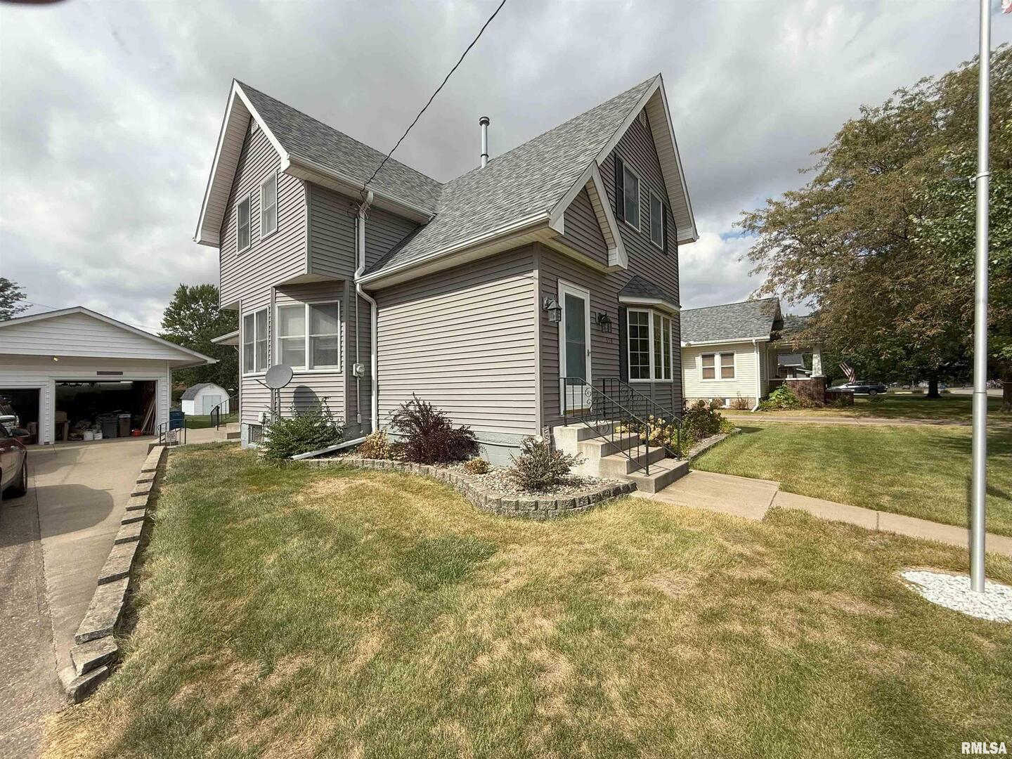330 North Main Street Walcott, IA 52773 - Photo 4 of 39 a view of house with yard
