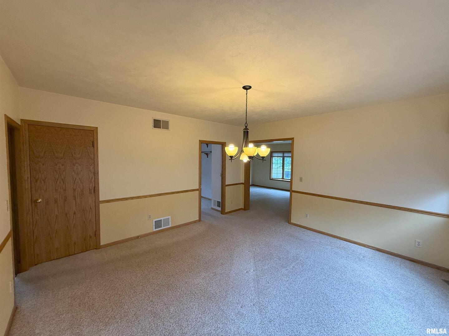 330 North Main Street Walcott, IA 52773 - Photo 8 of 39 a view of empty room with window