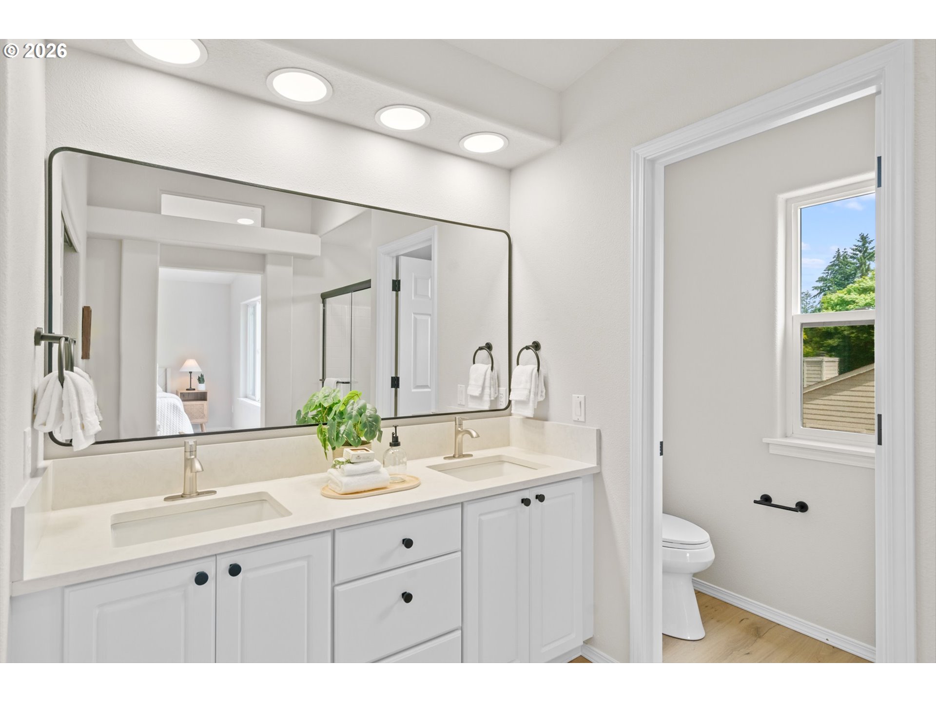462 Southwest 211th Avenue Beaverton, OR 97006 - Photo 24 of 40 a bathroom with a double vanity sink mirror and toilet