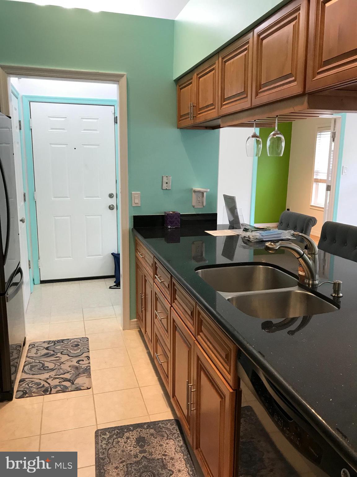 14101 Valleyfield Drive, Unit 94 Silver Spring, MD 20906 - Photo 20 of 62 Granite counter tiled kitchen