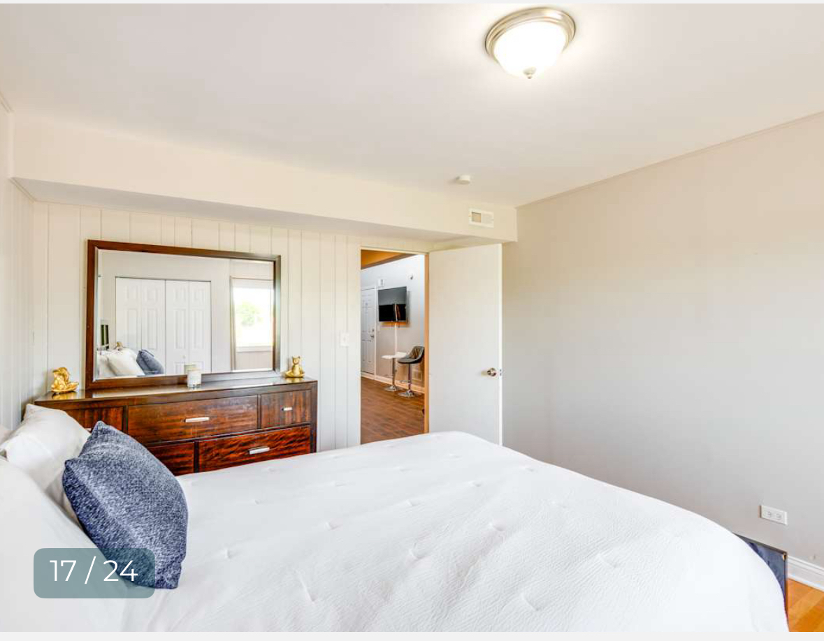 8136 South Kedzie Avenue, Unit 202 Chicago, IL 60652 - Photo 15 of 17 a bedroom with a large bed and dresser